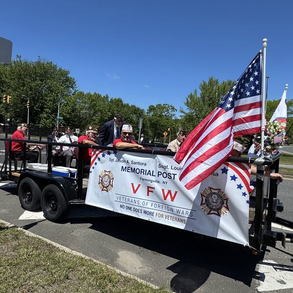 Post 400: 7 people, golf cart and text that says 'SgtJasonA Santora MEMORIAL Ssgt. MEMORIALPOST Louit V artingville, POST VET ¡ETERANS OF FORE GN WAR w 0 ON ONE ONE DOES MORE FOR ETERANS *南町5'
