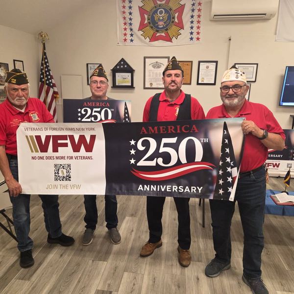 Members holding a VFW 250 anniversary banner