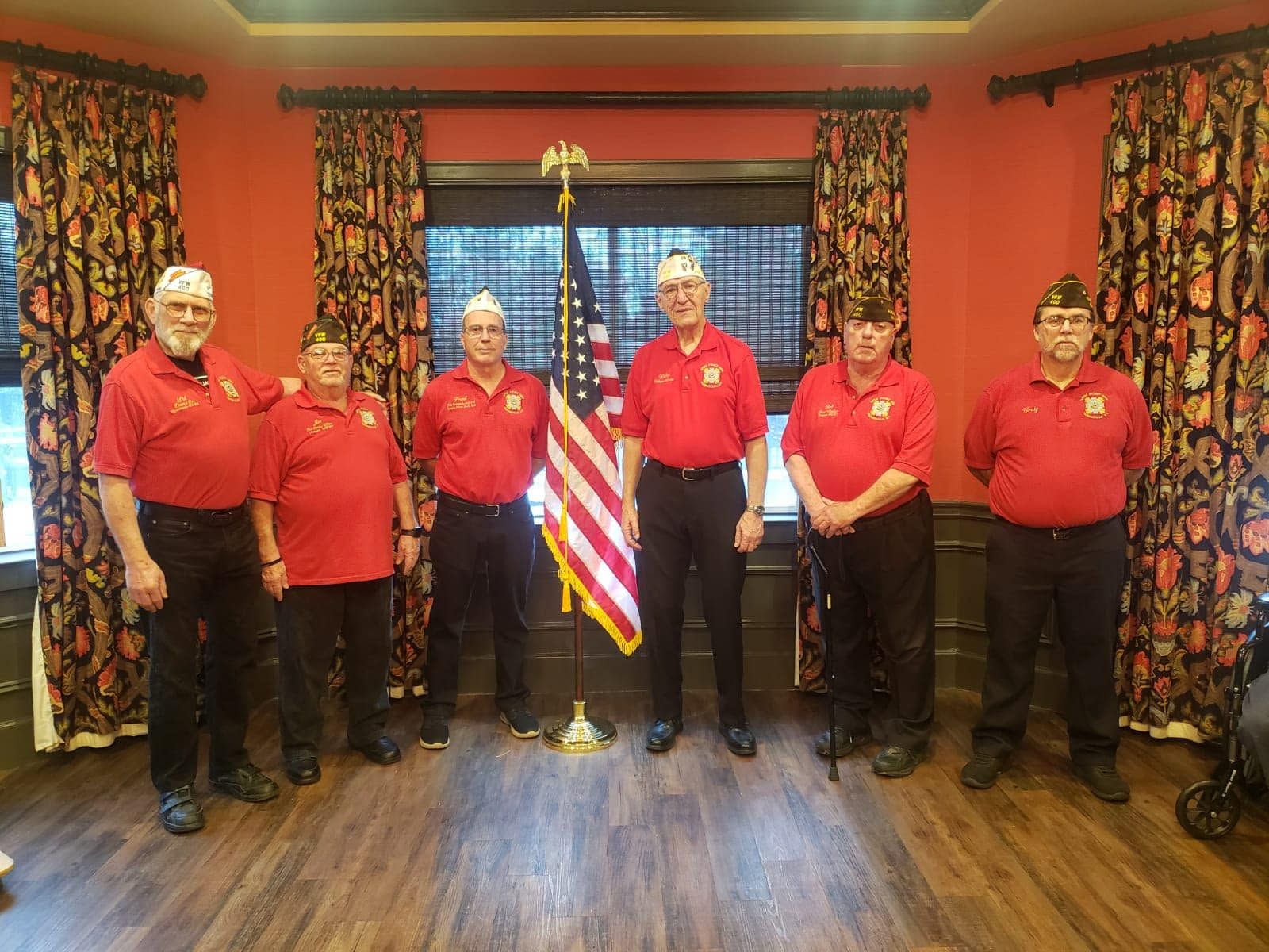 Post 400 members standing together in a hall